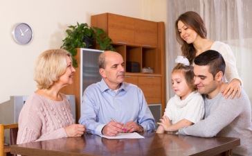 Elder Couple With Younger Family